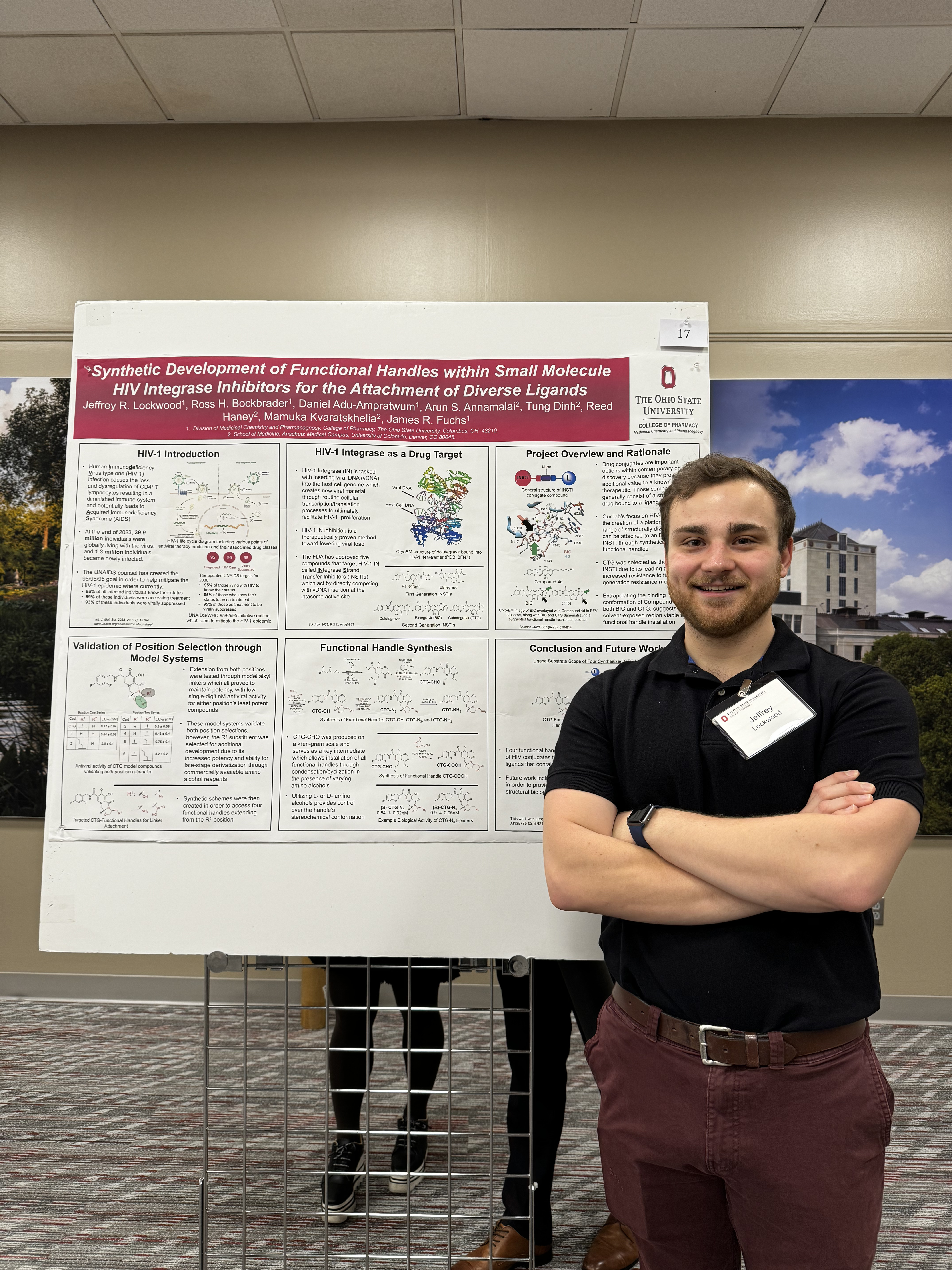 Jeff Lockwood standing next to poster