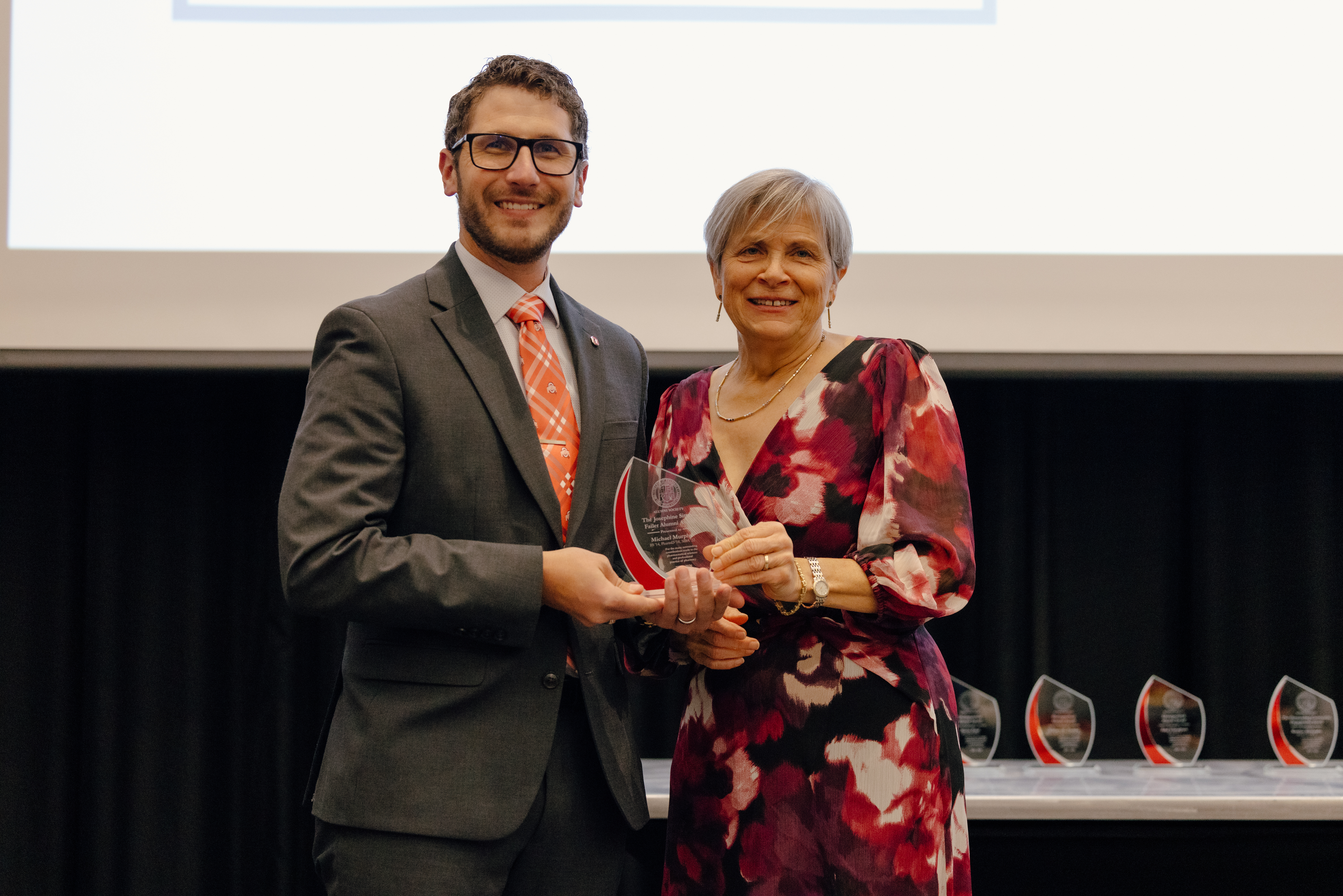 Dr. Murphy and Dean Deanna Kroetz receiving the Josephine Sitterle Failer Alumni Award