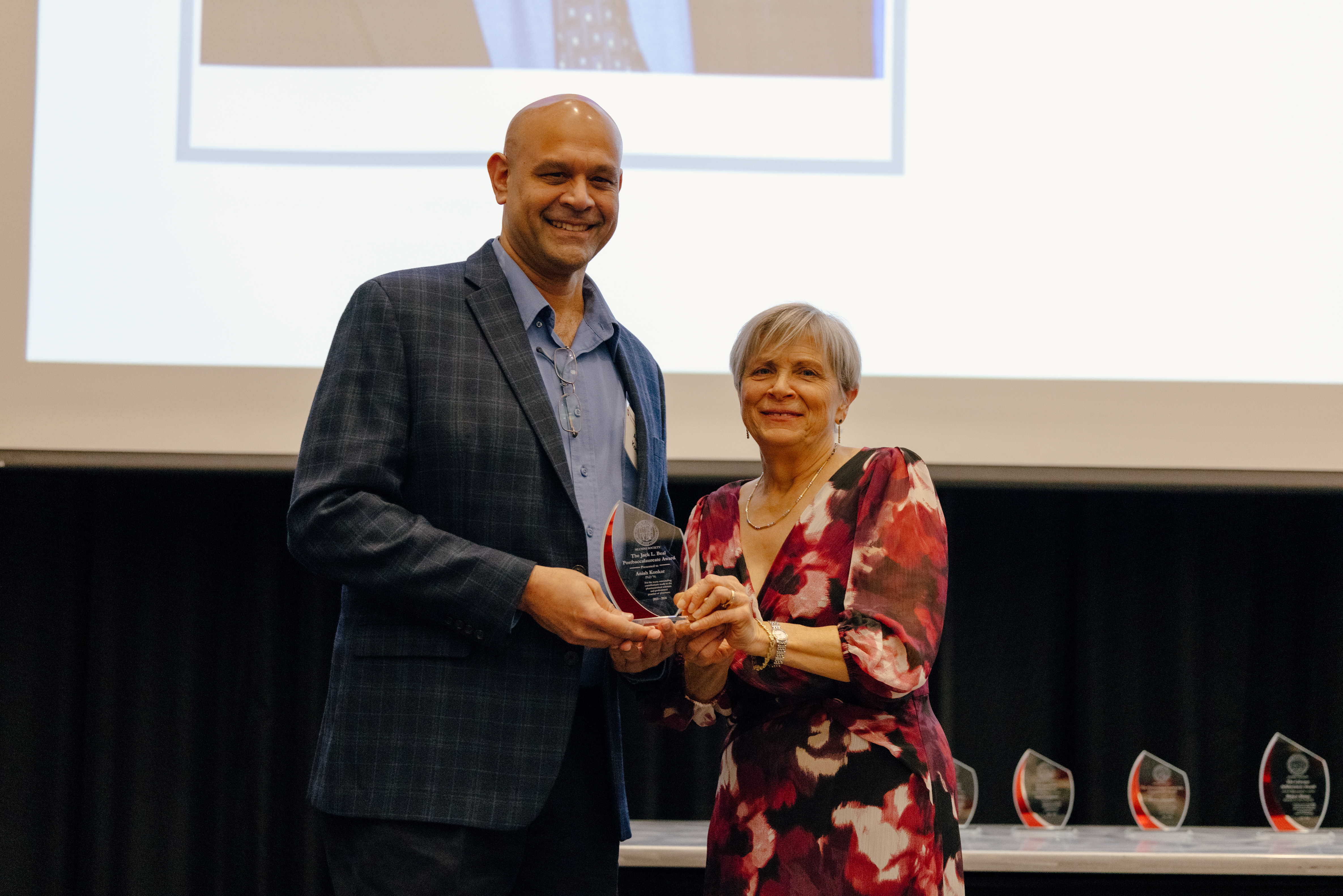 Dr. Konkar and Dean Deanna Kroetz presenting the Jack L. Beal Post-Baccalaureate Award