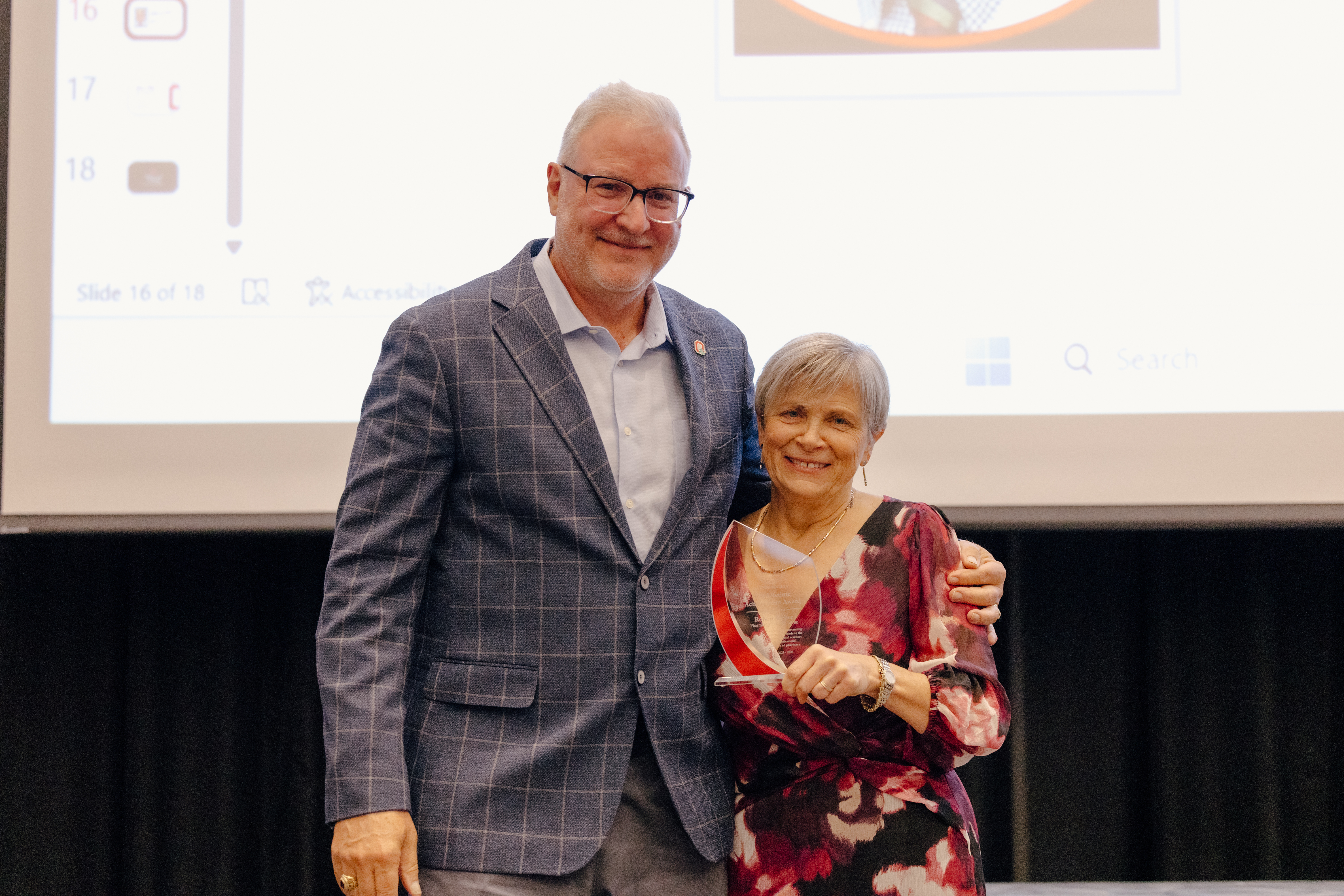Dr. Weber with Dean Deanna Kroetz presenting the Lifetime Achievement Award