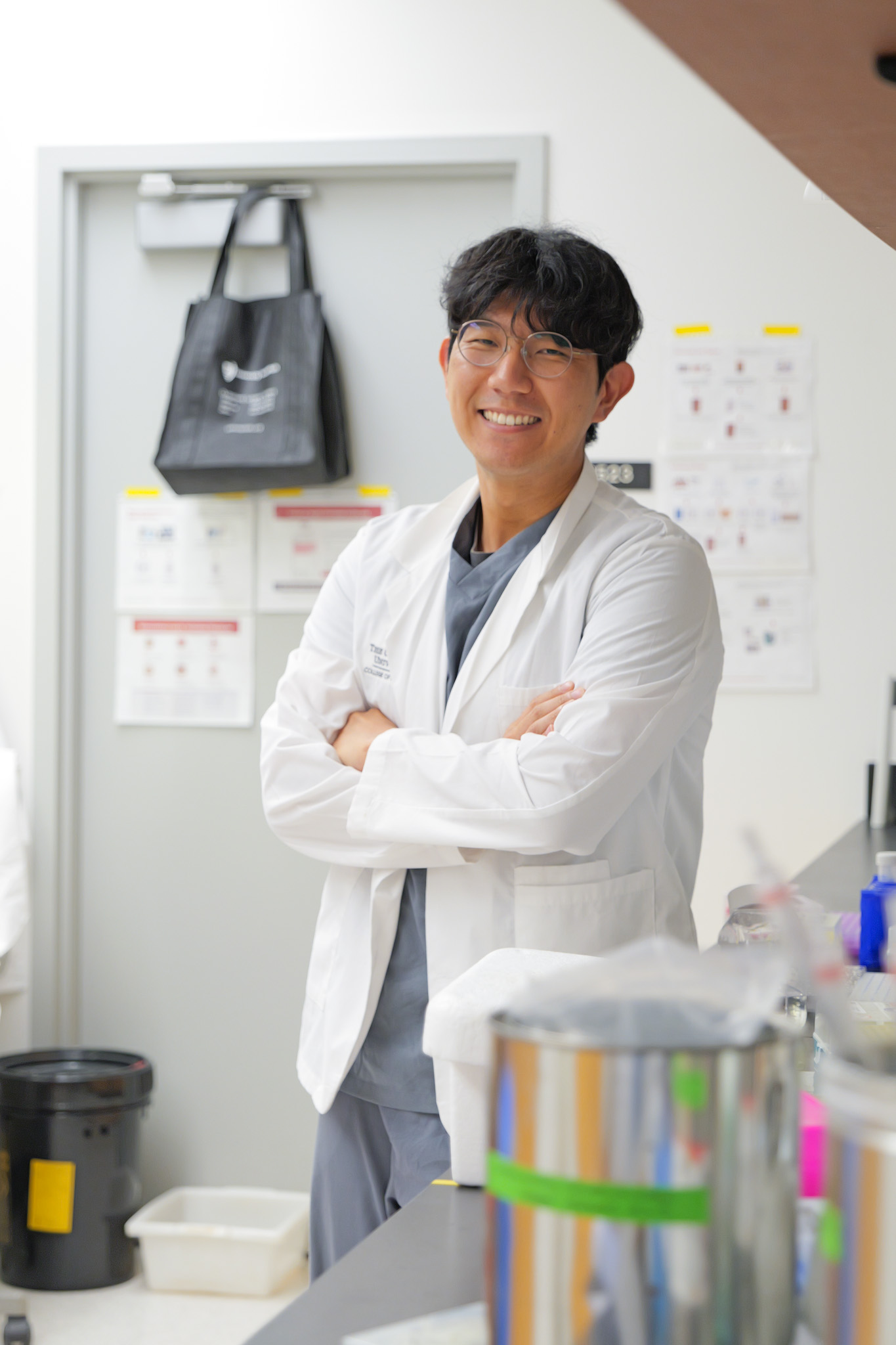Jin Gyu Kim smiling at a lab bench