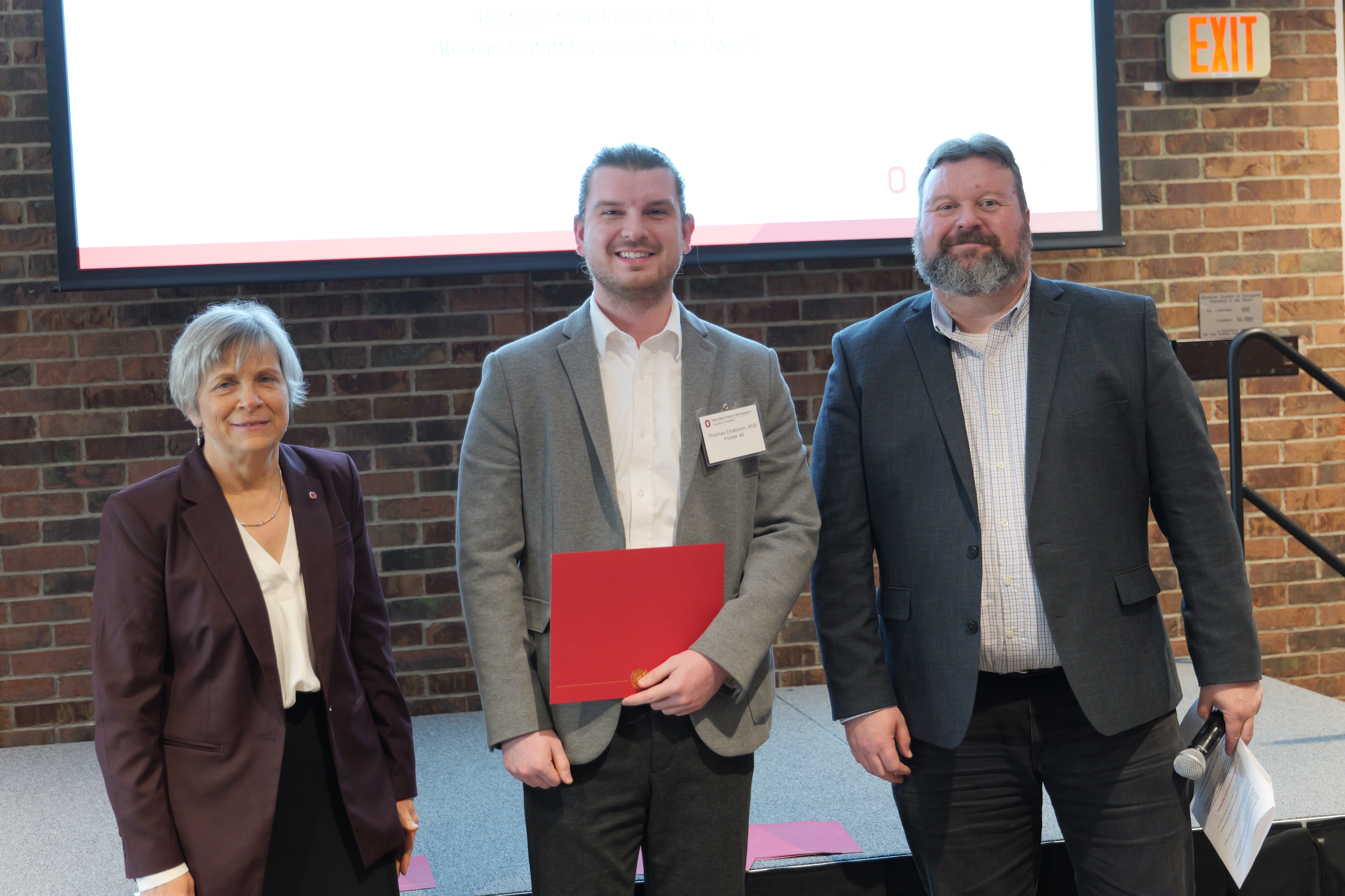 Thomas with his certificate 