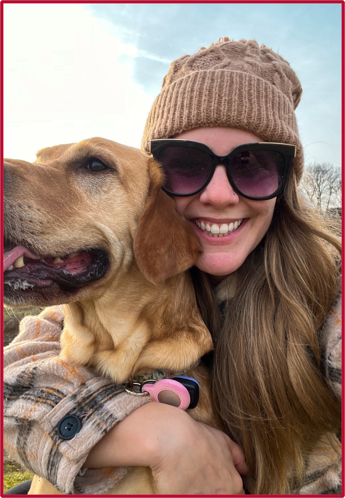 Katie holding her dog