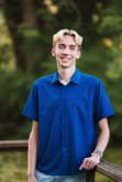a person posing outside