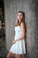 a person posing along a wall