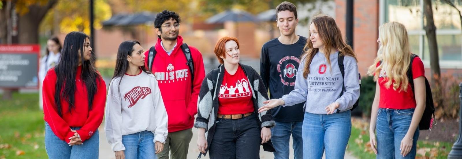 students walking along a sidewalk