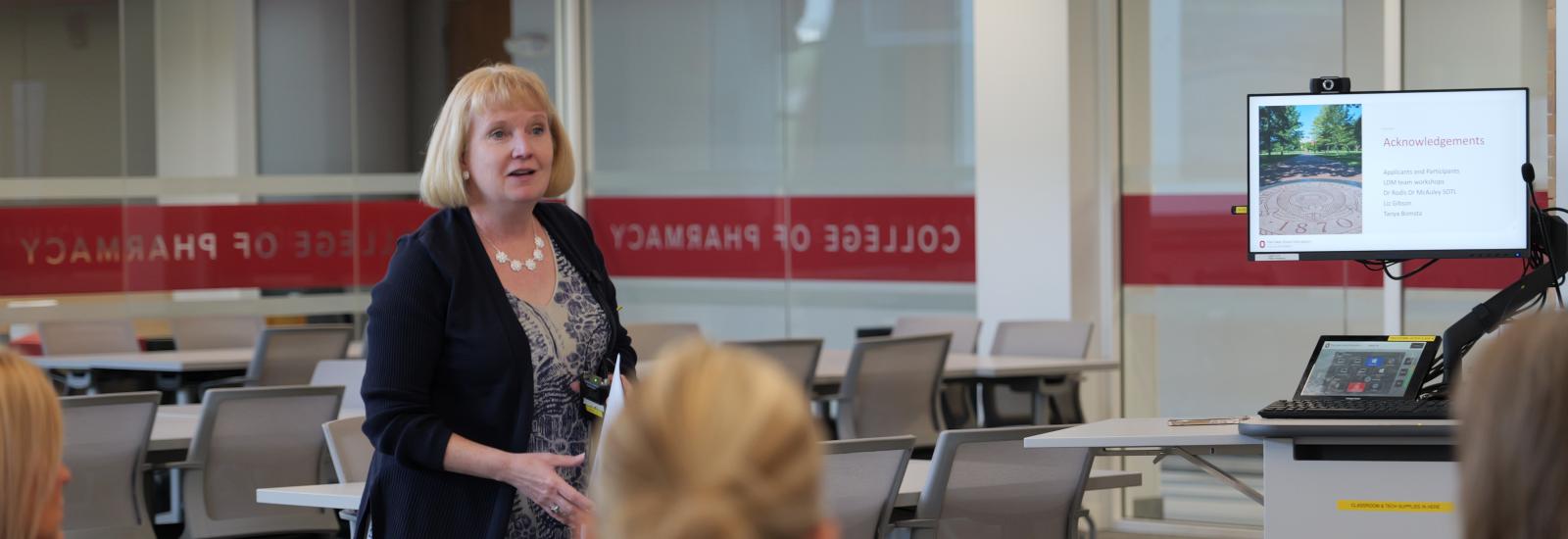 kathy kelley giving instruction in a classroom