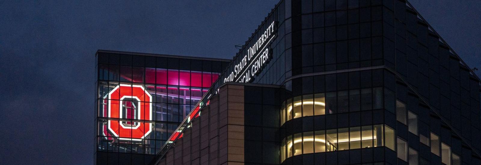 Photo of Block O lit up in the new University Hospital tower
