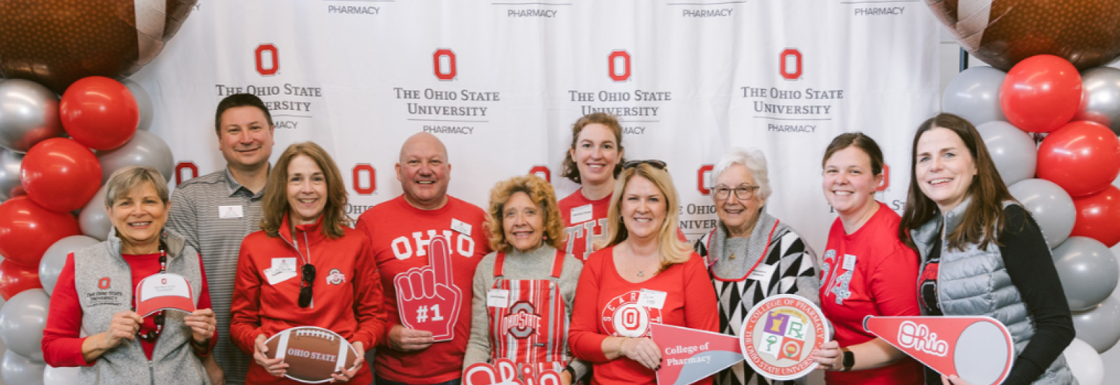 Group posing for a photo at Homecoming Weekend Tailgate