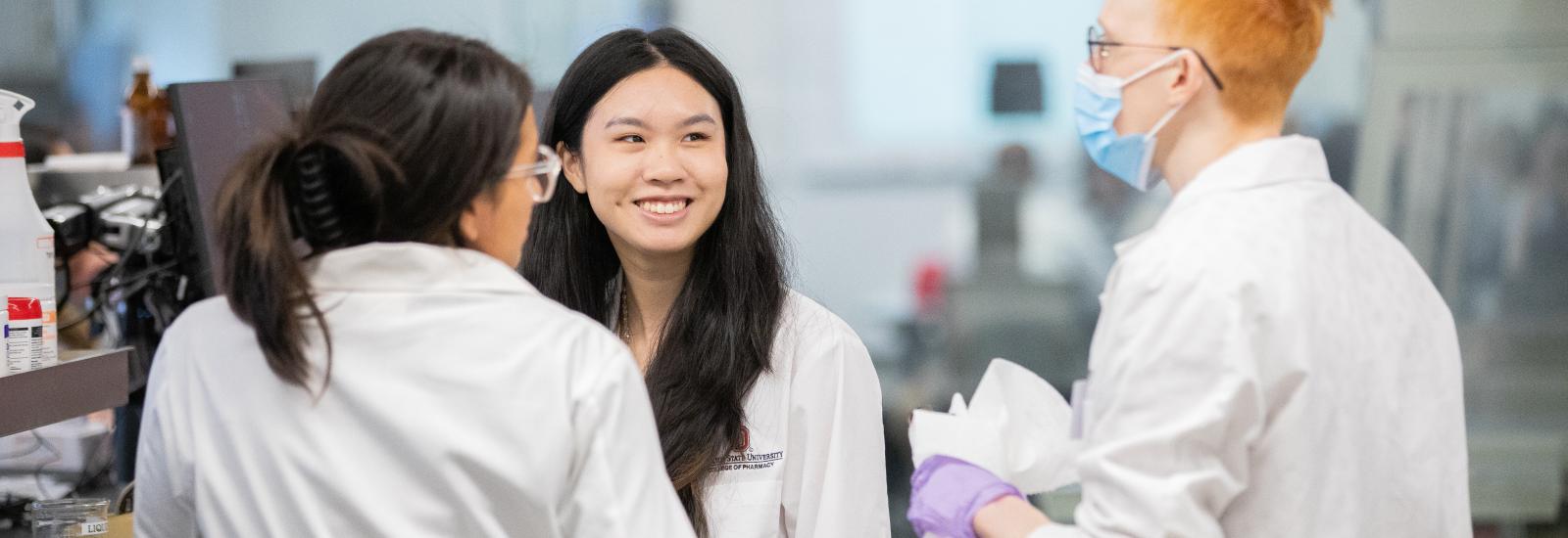 Students talking in lab space