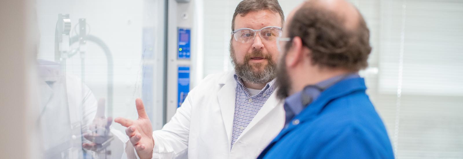 two scientists talking