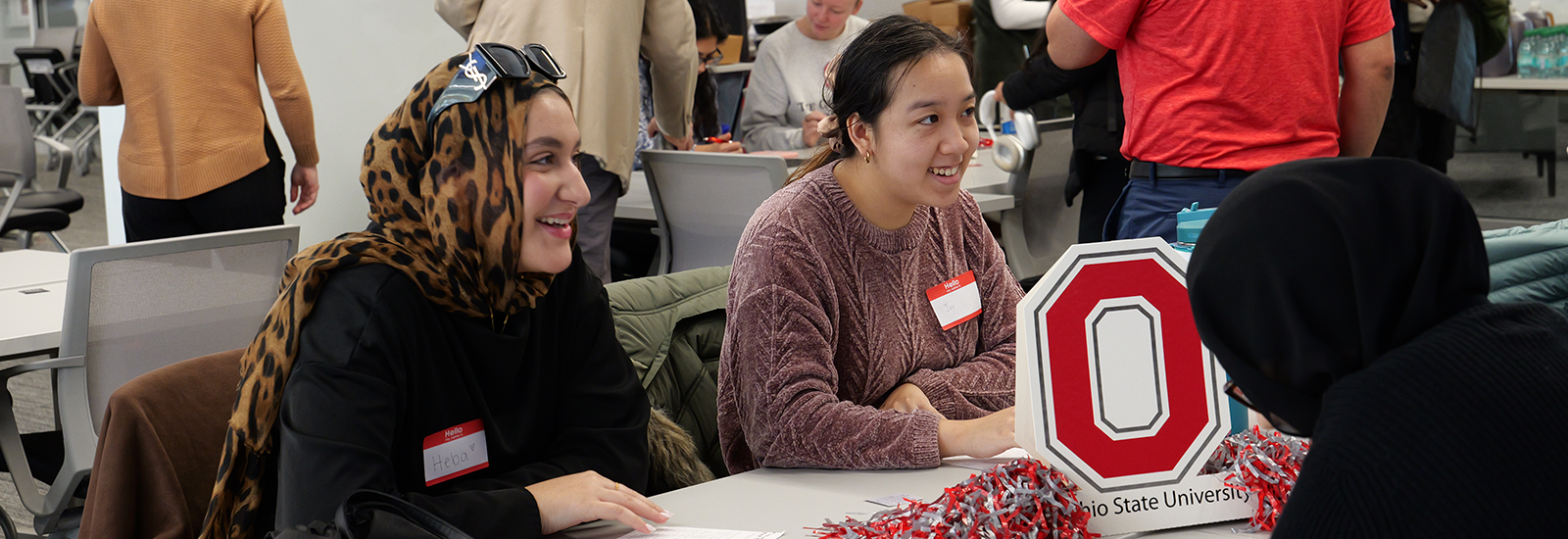 First-gen students sitting at a table introducing themselves.