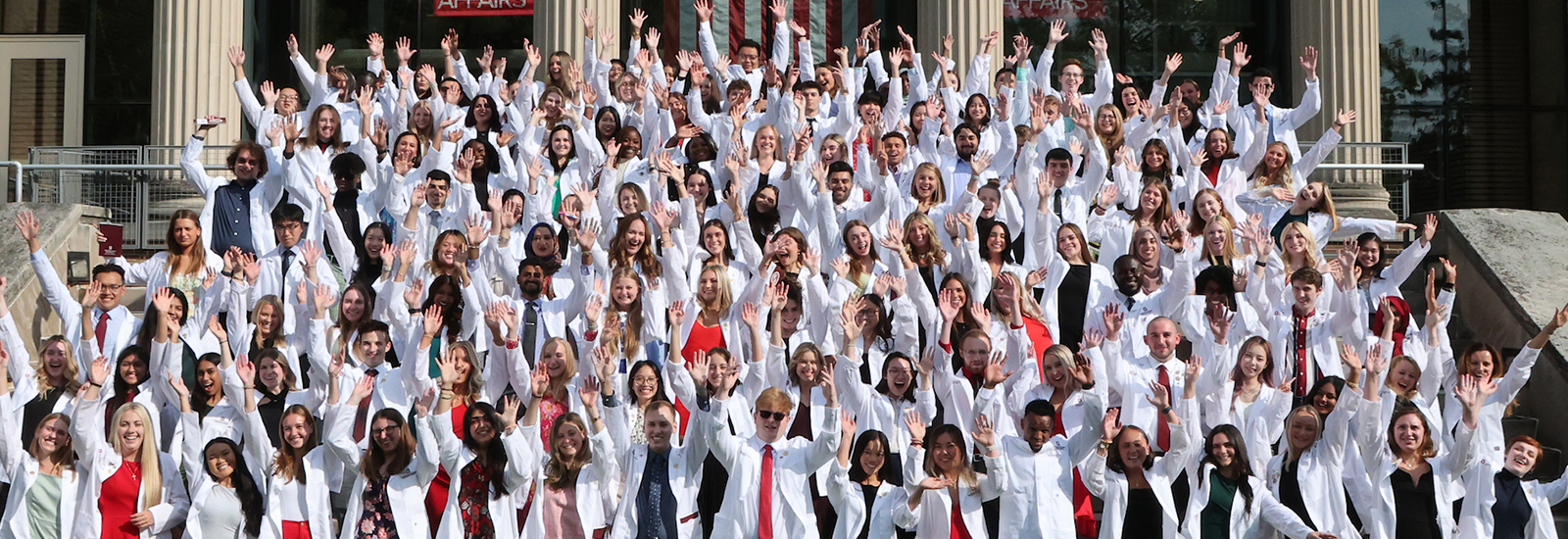 Image of the white coat class rejoicing