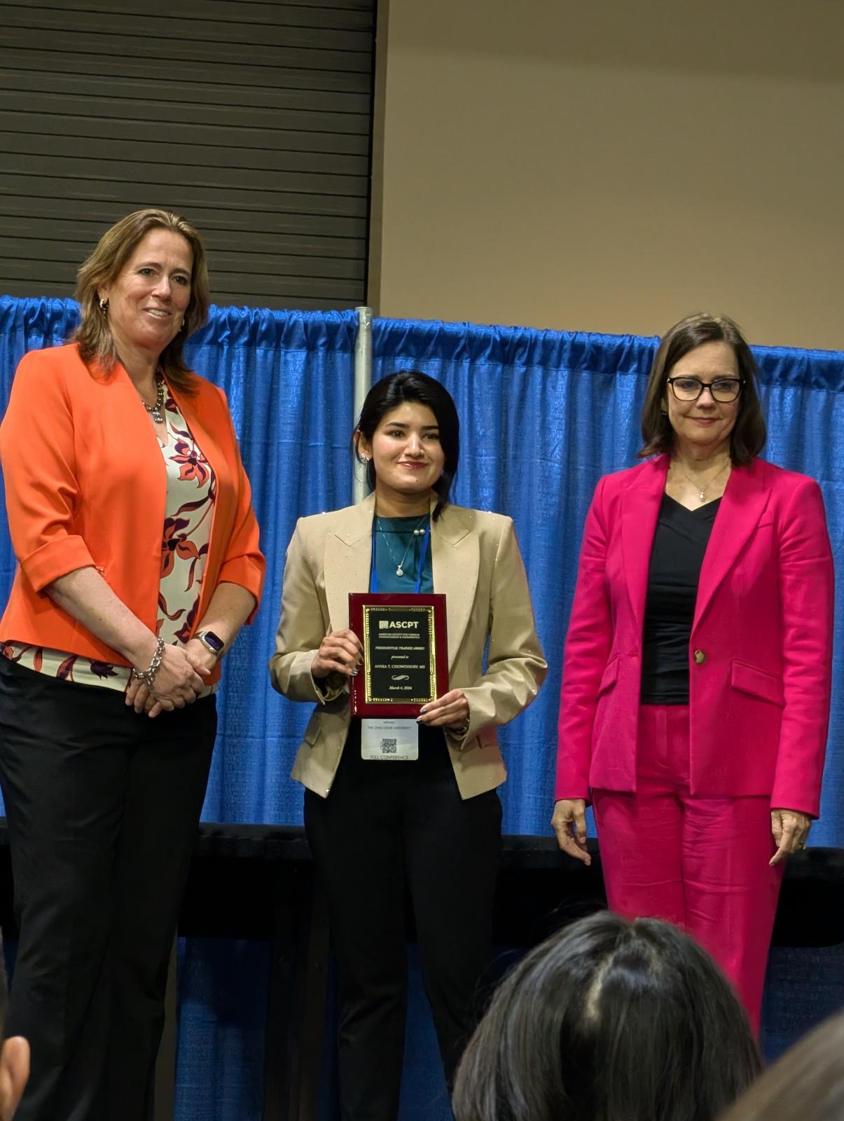 Anika Chowdhury receiving her award.