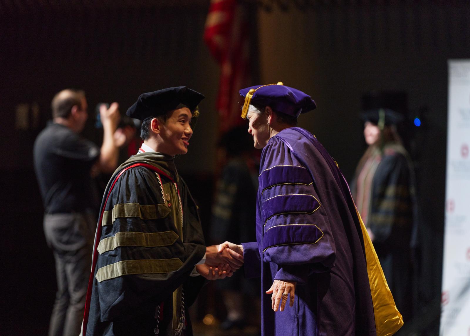Dr. Gao at the 2024 PharmD Hooding Ceremony