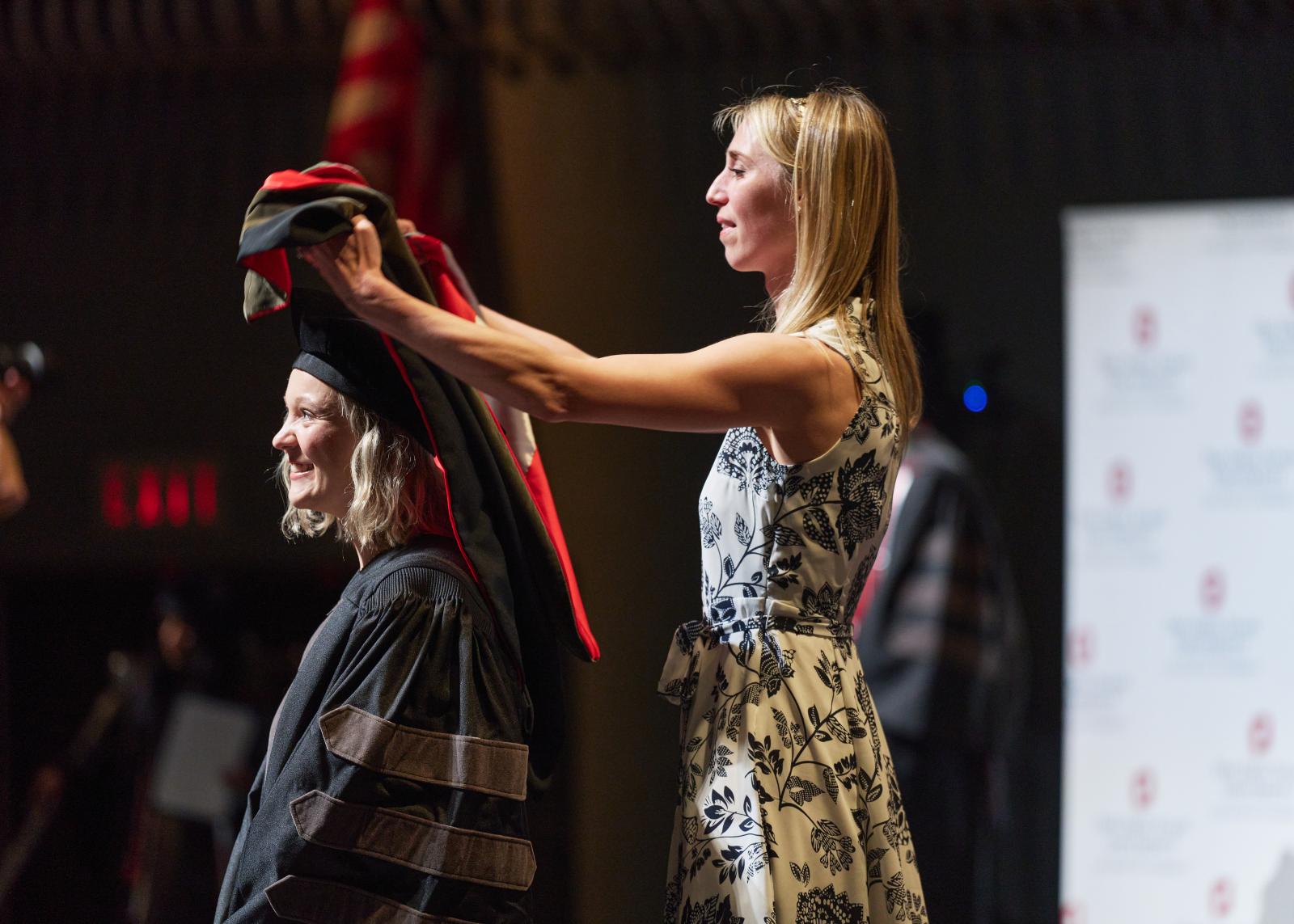 Shannon Peck being hooded by Katherine Crawford