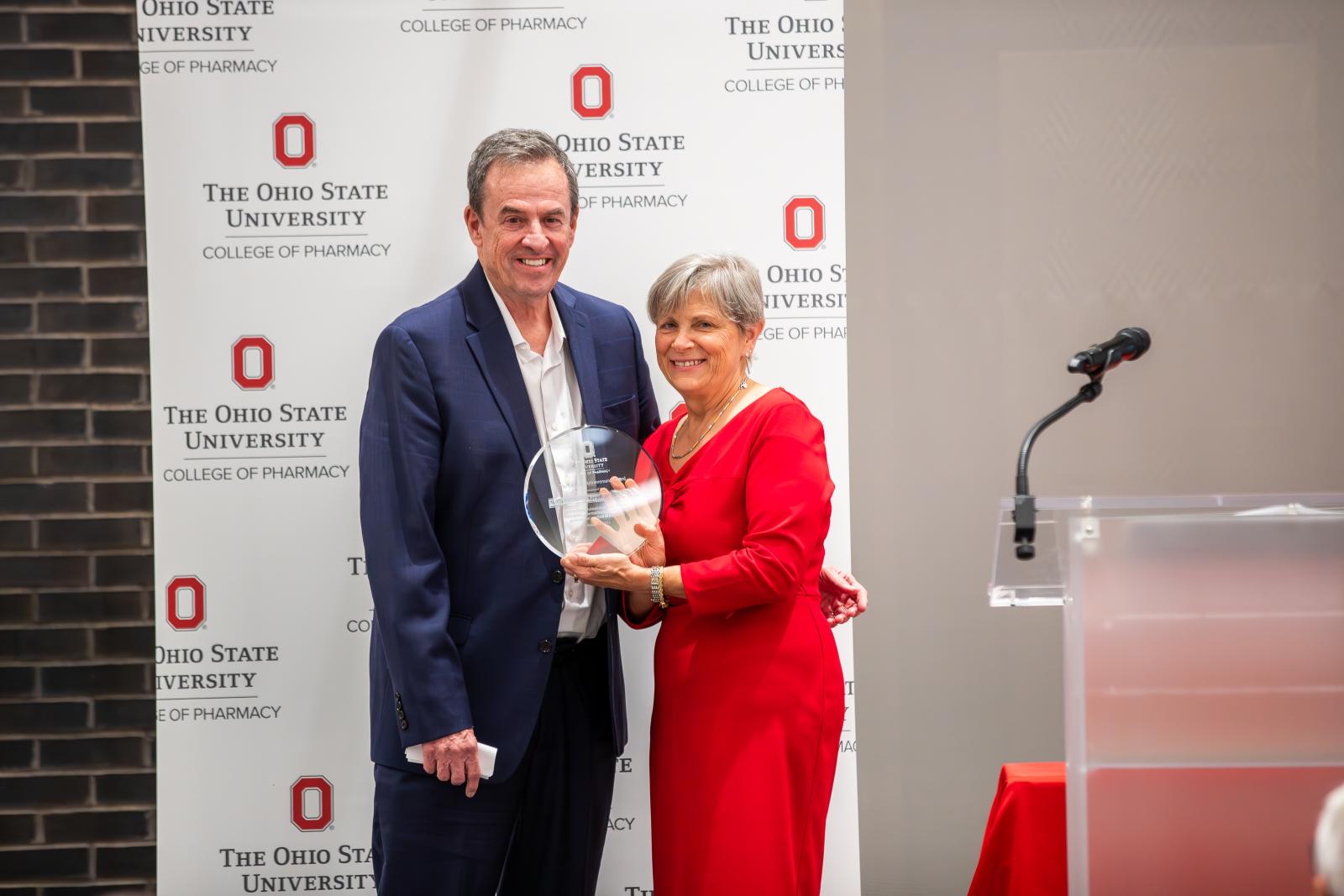 Bill Miller accepting his award from Dean Kroetz