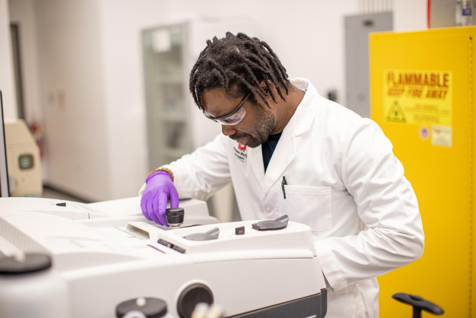 Dr. Adu-Ampratwum working in he Fuchs Lab