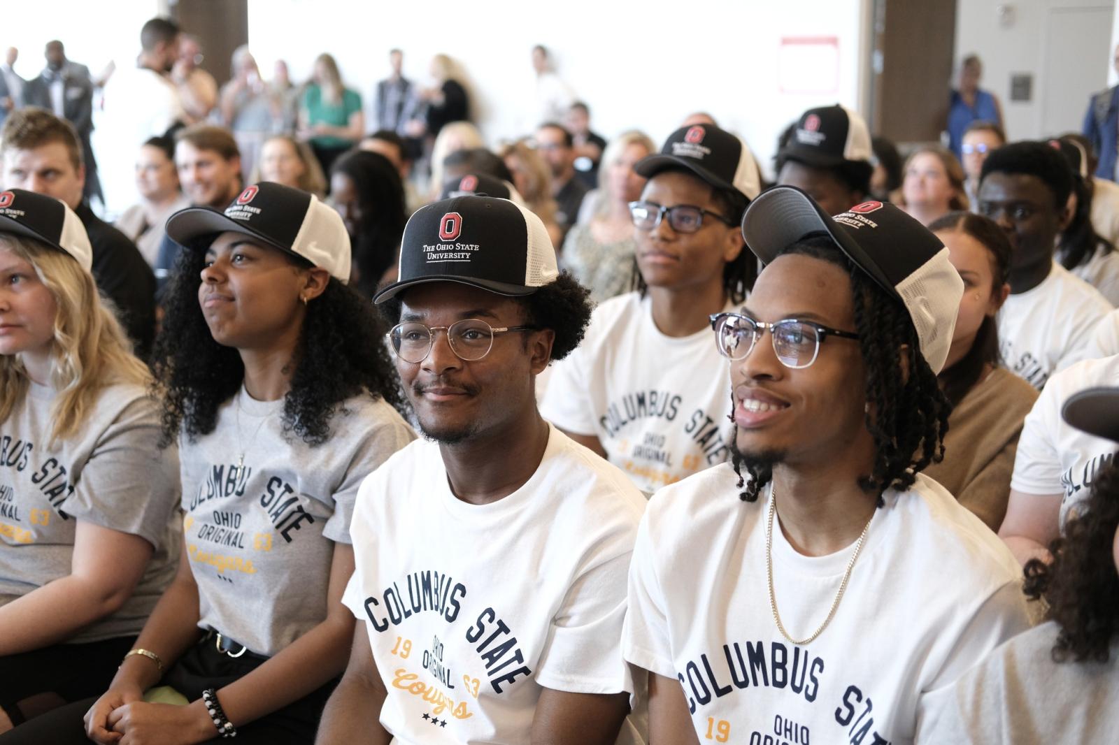 Students at Columbus State wearing Ohio State hats