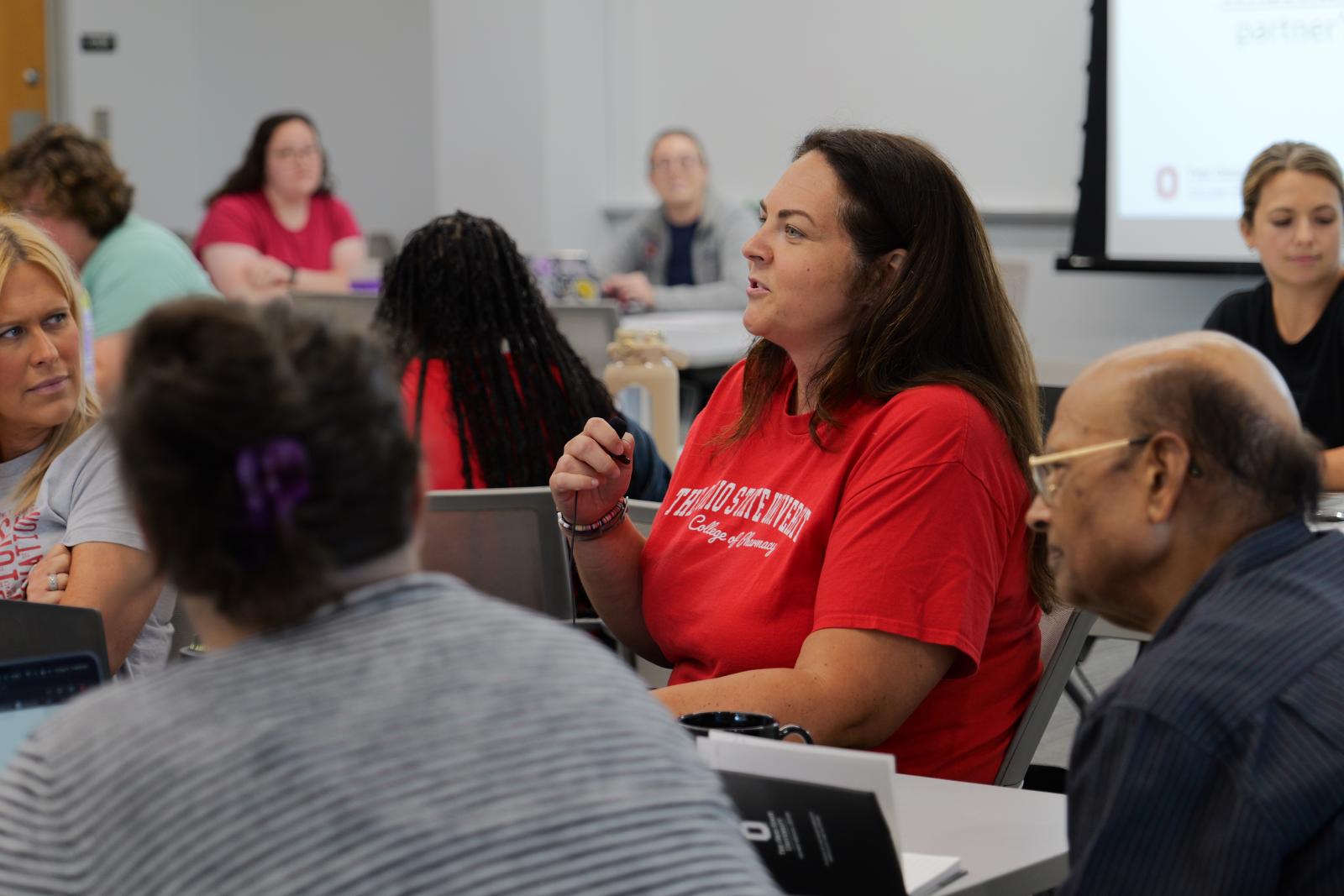 Stacy King asking a question at Dr. Mize's EdiPhy presentation