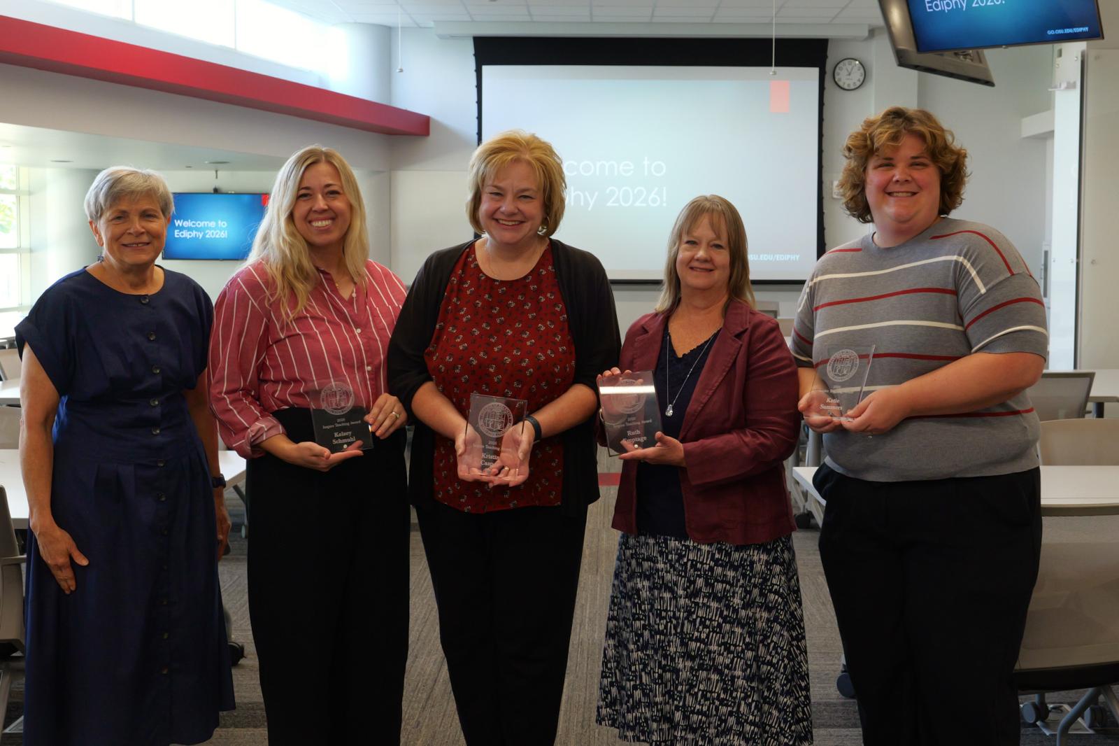 Inspire Award winners holding their trophy