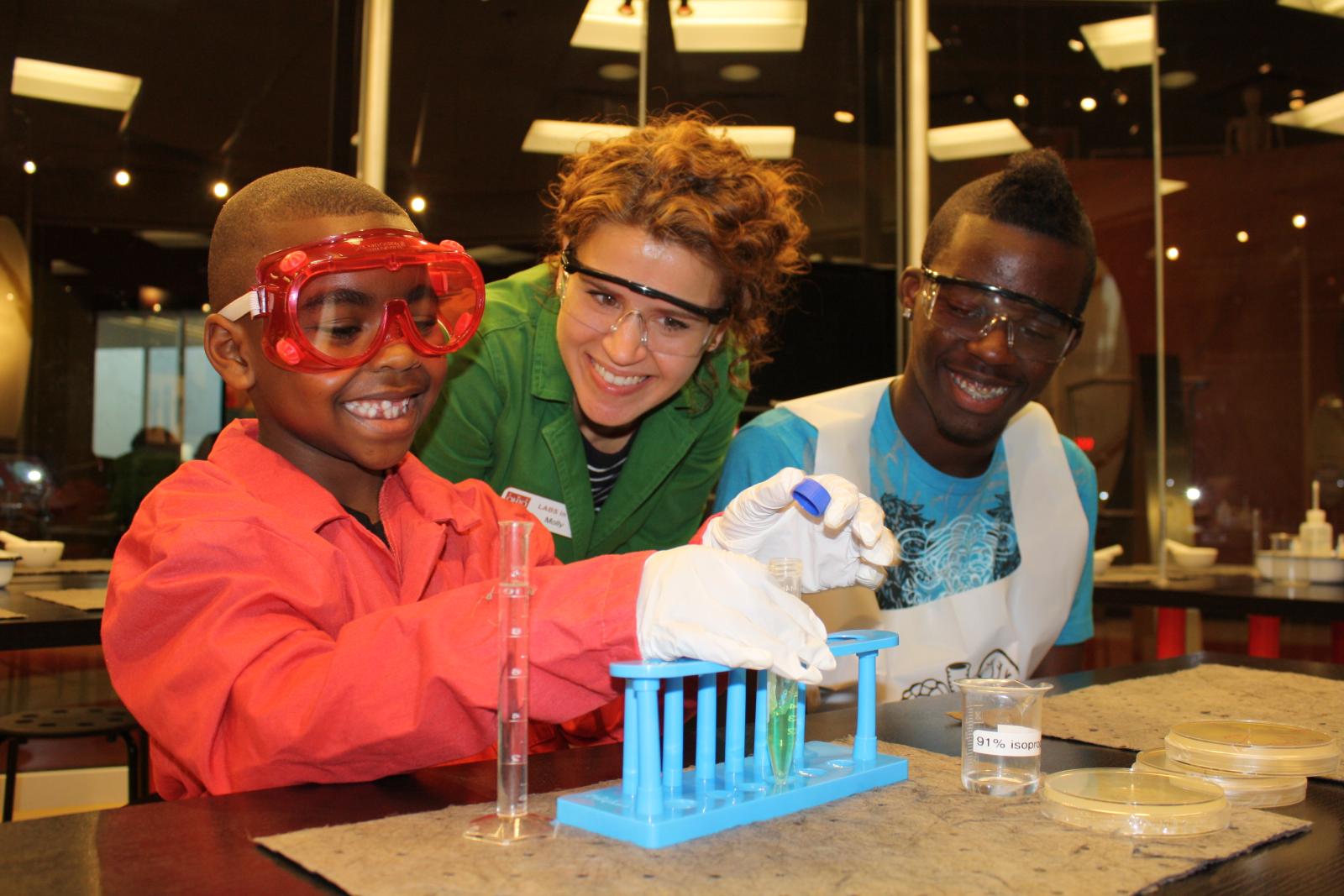 Molly Downing working with COSI visitors