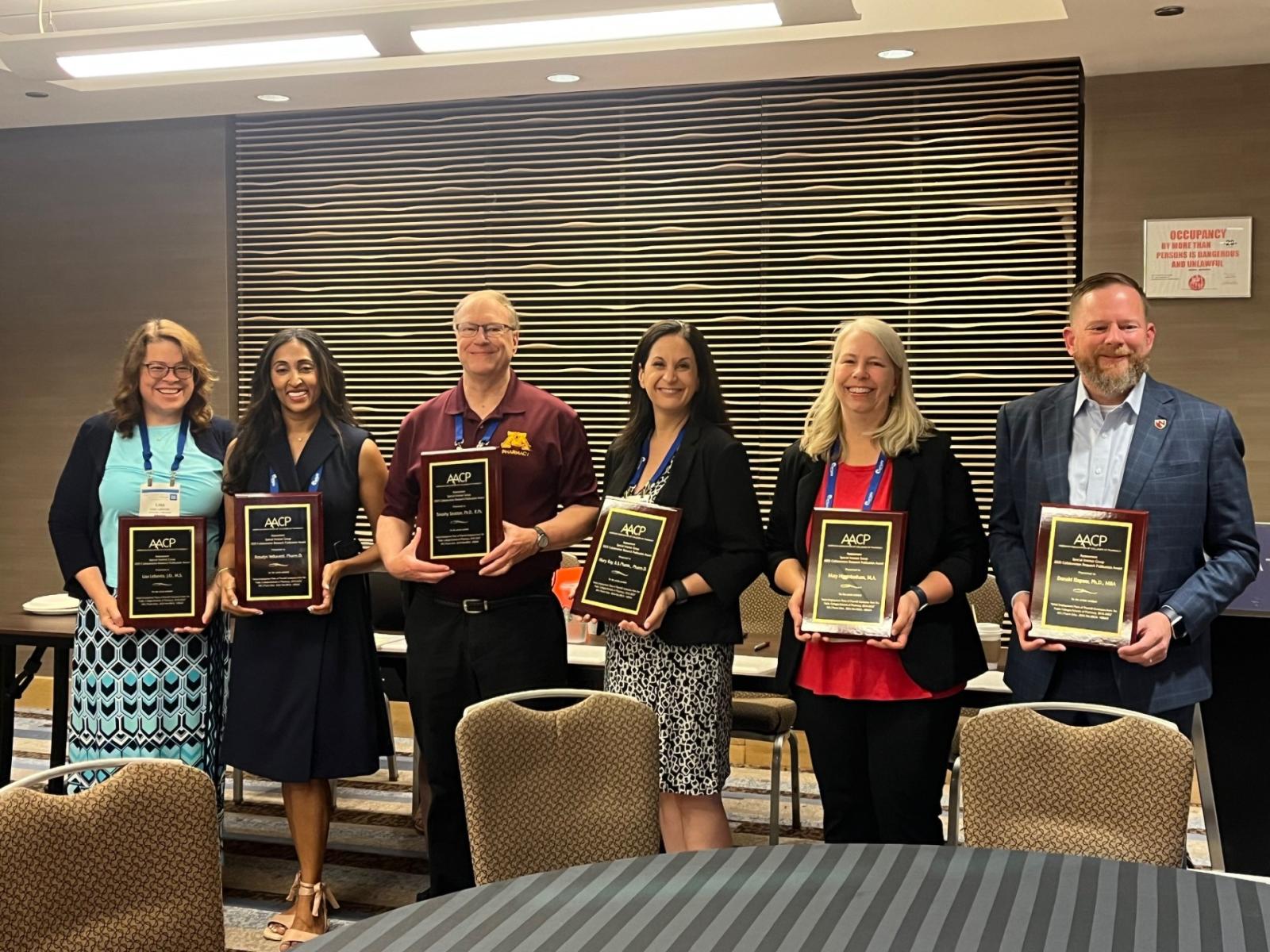 Mary Higginbotham with co-authors receiving the award at AACP Pharm Ed 2025