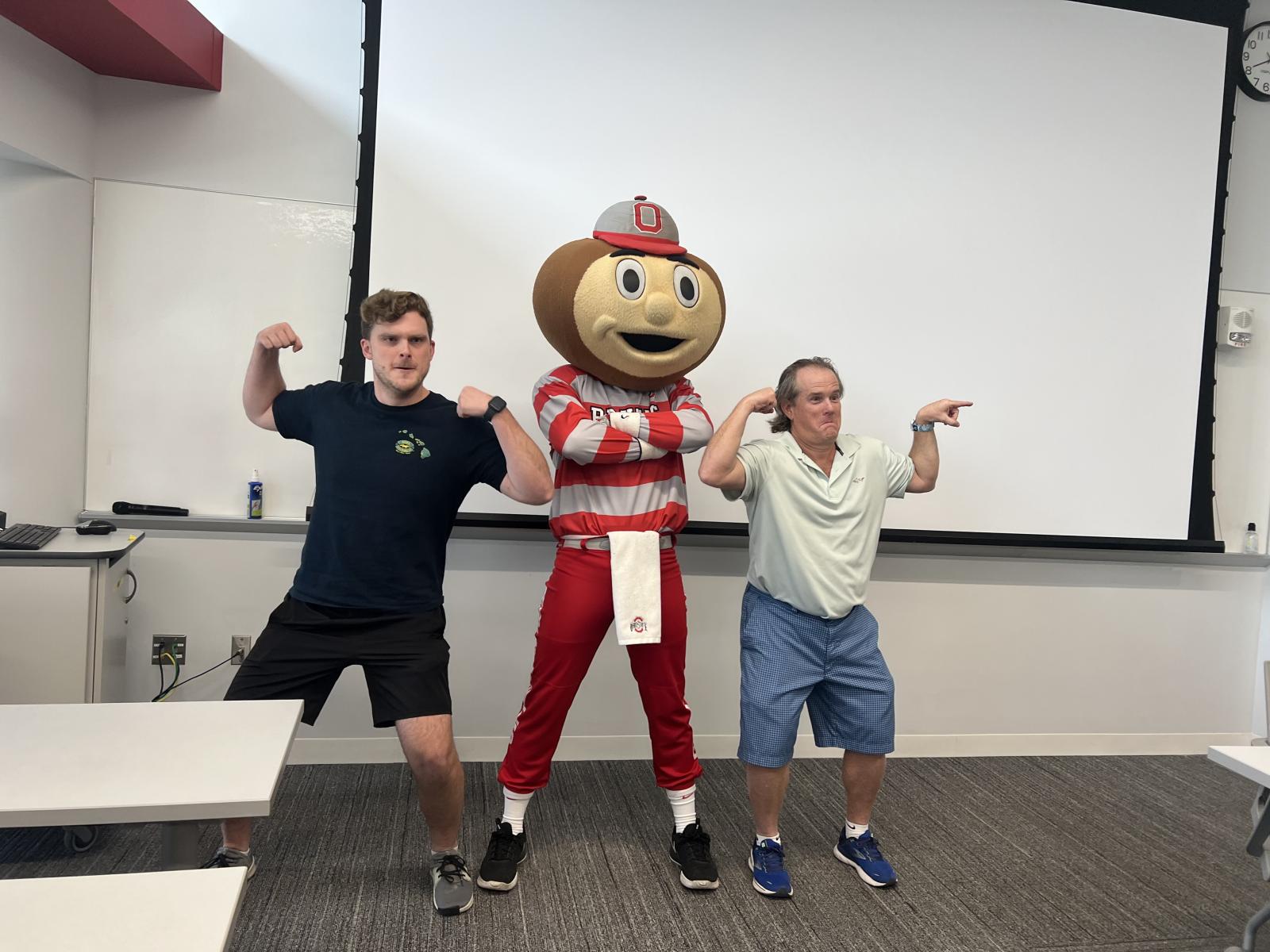 Dr. Sullivan, Brutus and student at exam photo op