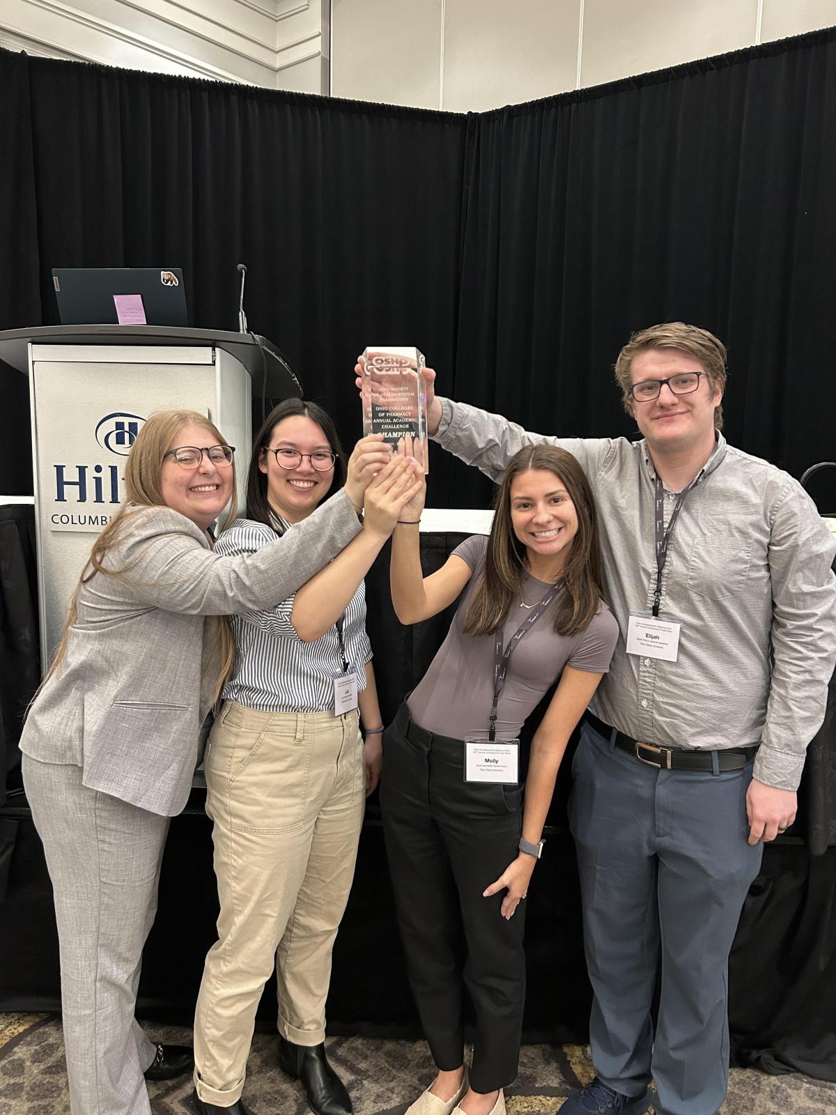 Student team holding their trophy