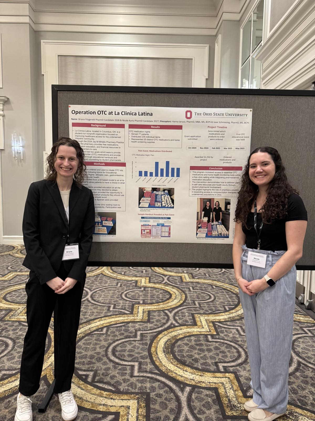 Briana and Nicole in front of their poster