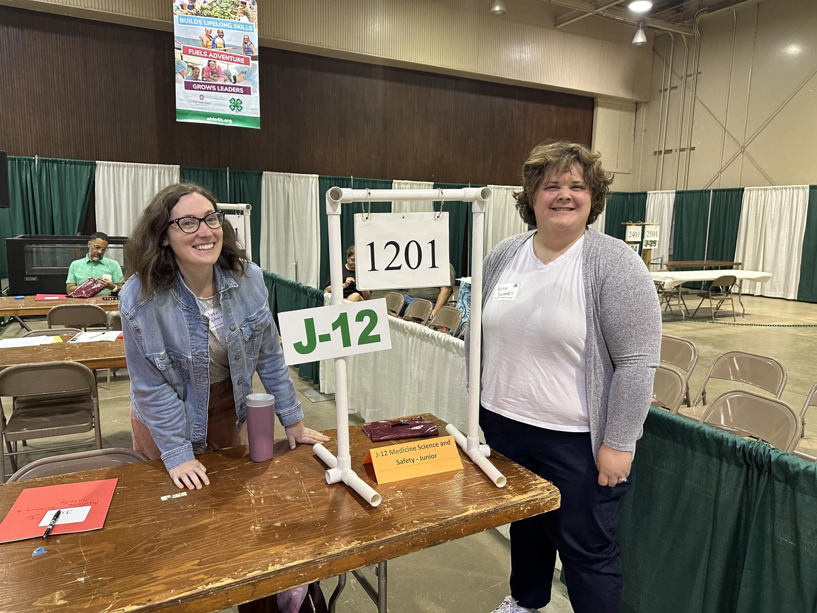 Josie Silvaroli and Katie Summrs at the 4-H judging table