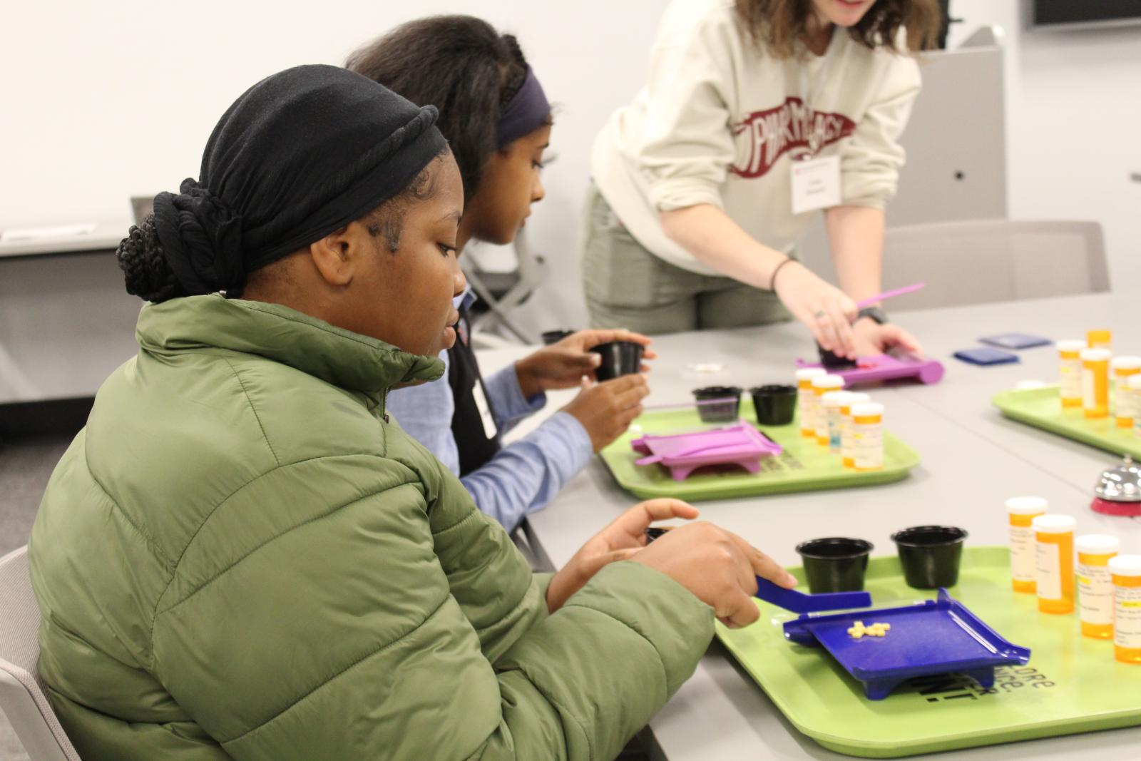 Woman simulated medication counting with beads.