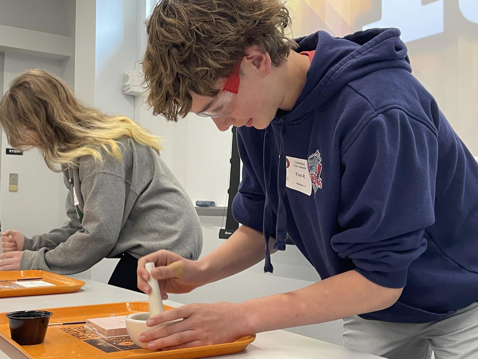 Student completing a compounding simulation