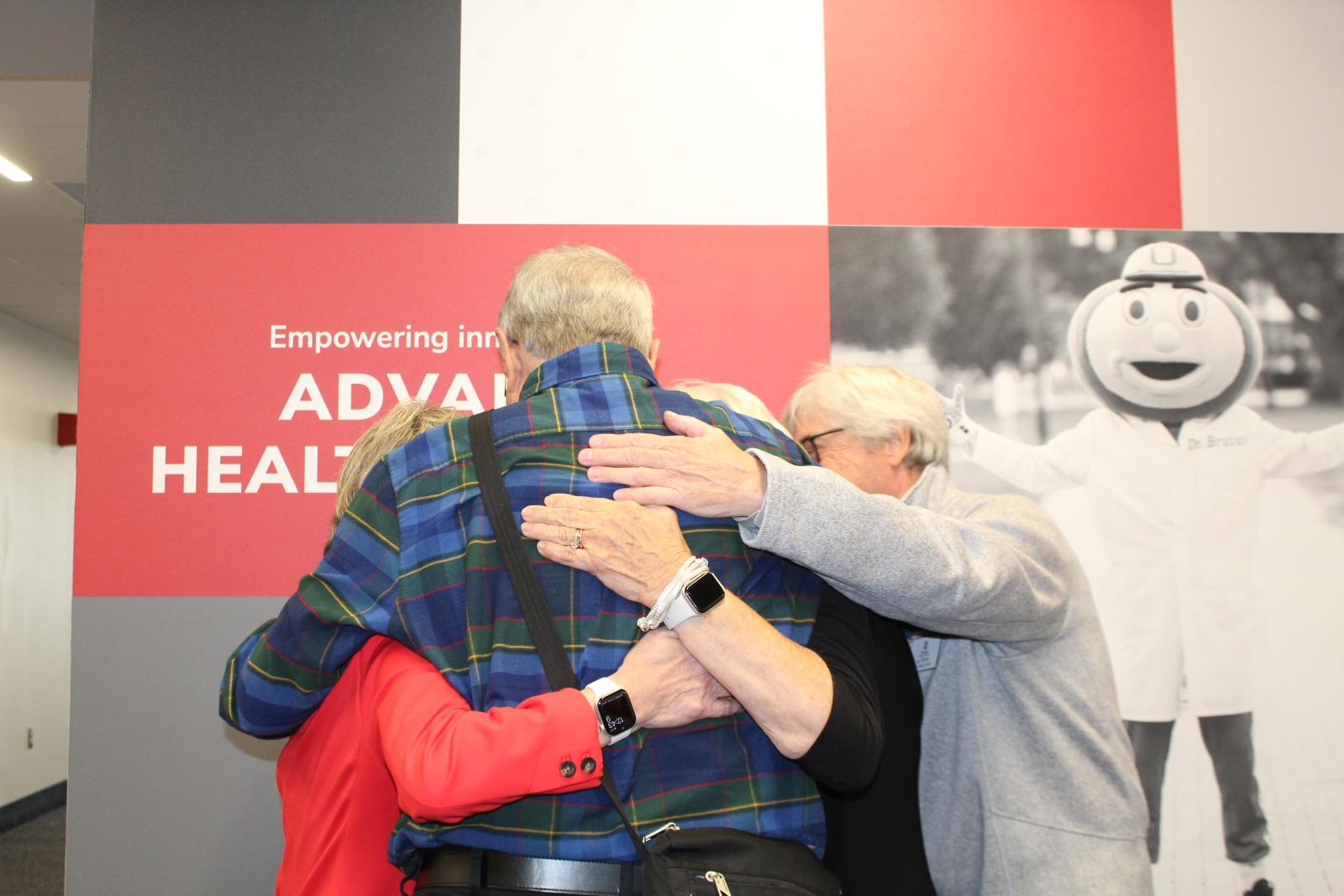Group photo of people hugging