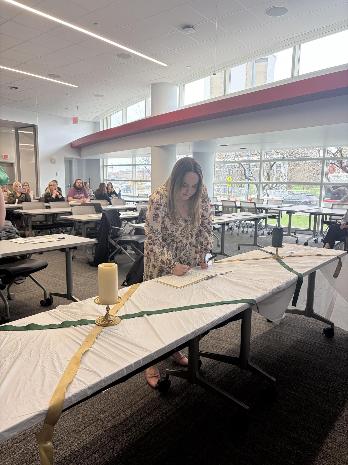 New member signing a book