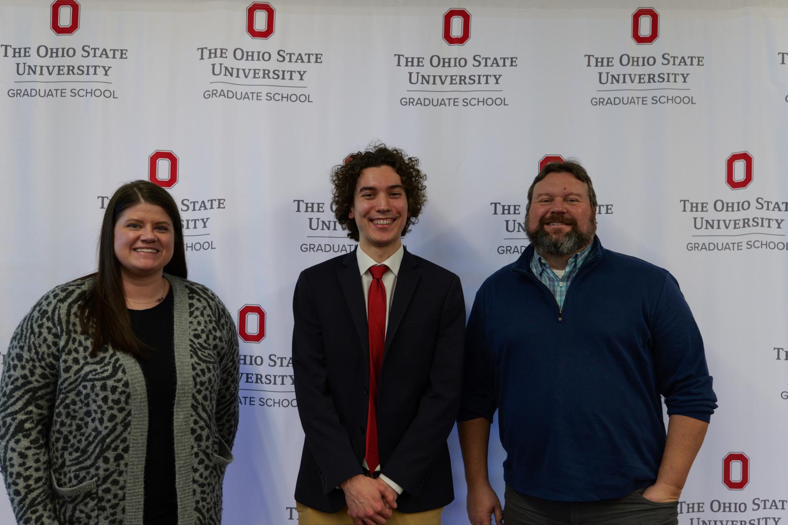 Jessica Costic, Isaac Karel and Jim Fuchs at the 3MT Competition