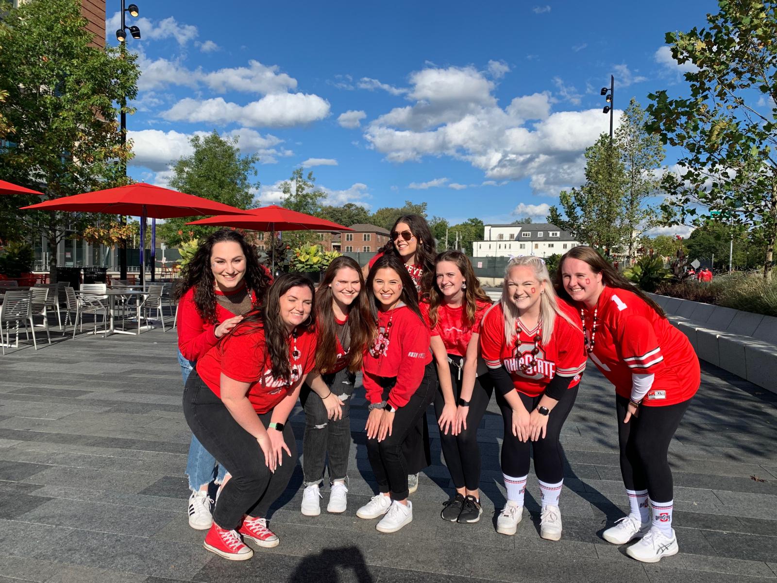 Julia Miller, center, with her friends before a football game
