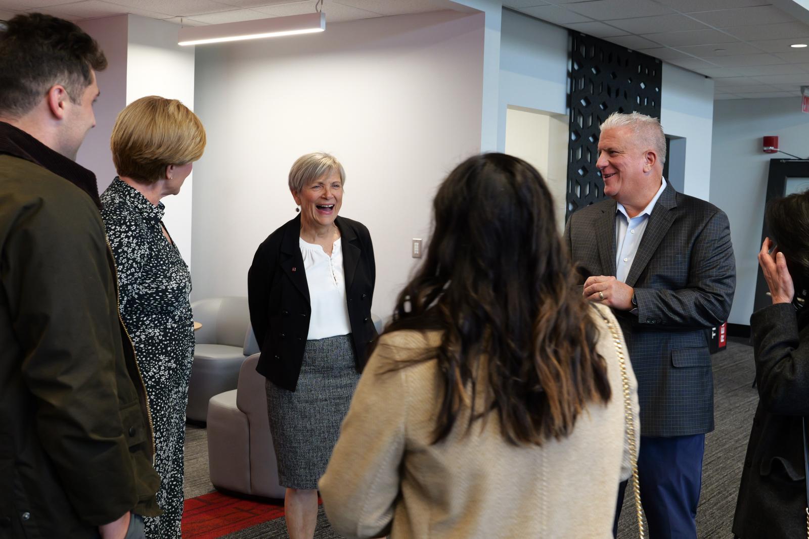 A group of individuals talking.