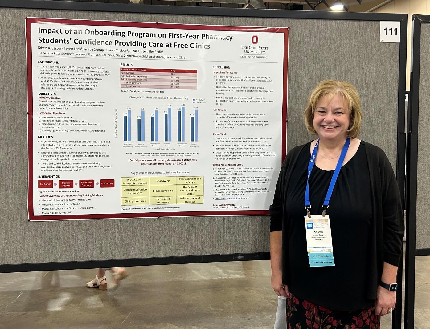 Dr. Casper in front of her poster presentation 