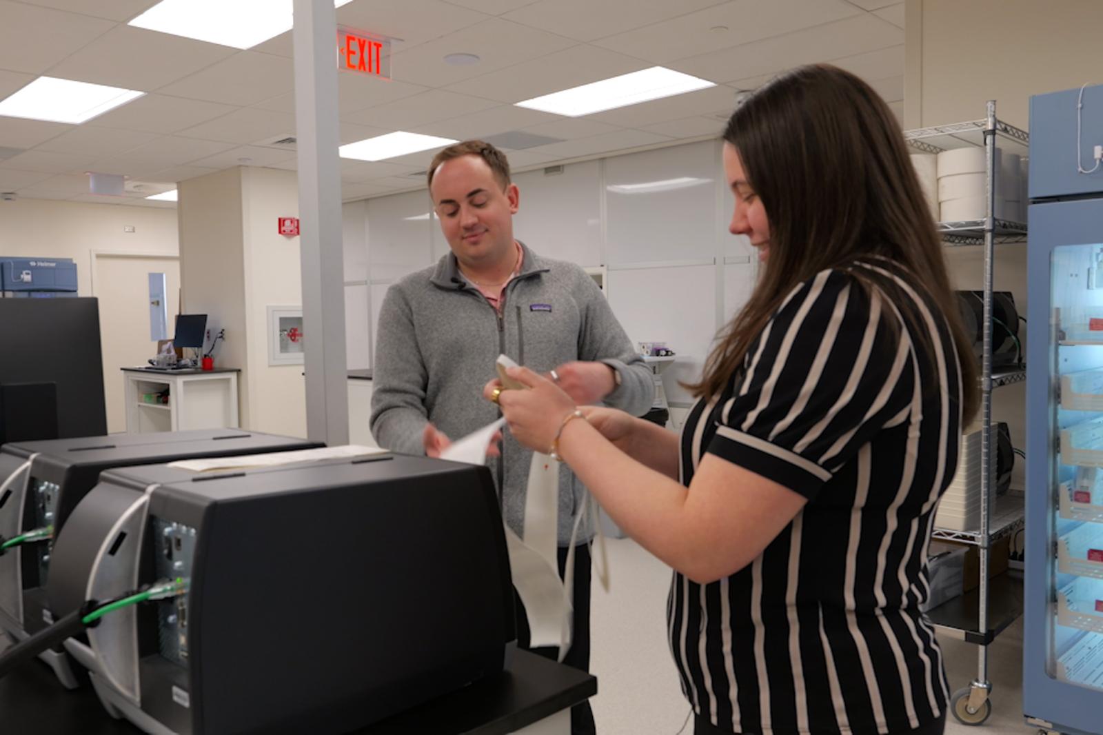 Drs. McWilliams and Iarussi reading medication labels in new pharmacy space
