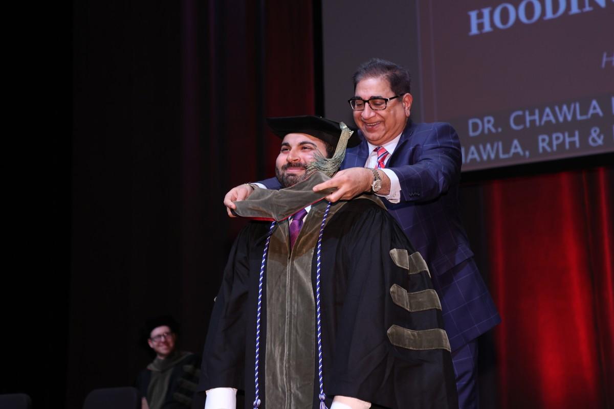 Ash Chawla hoods his son, Dr. Ashray Chawla