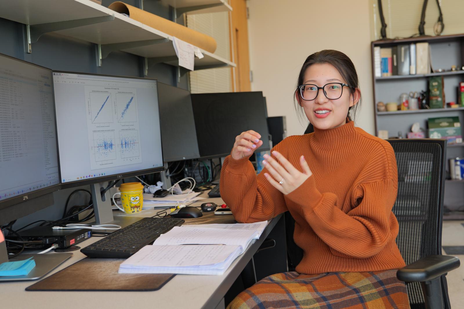 Min Hai in the Phelps graduate students' office
