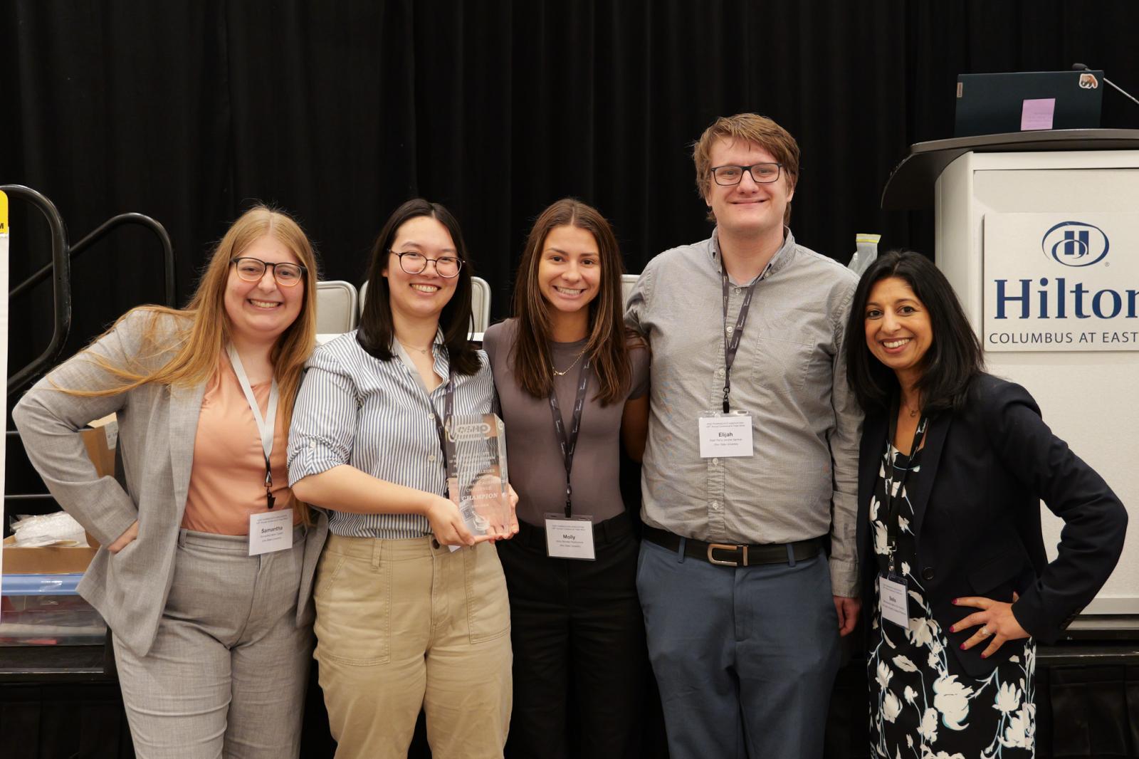 Students and Dr. Mehta posing with the Self-Care Student Pharmacist Challenge Trophy