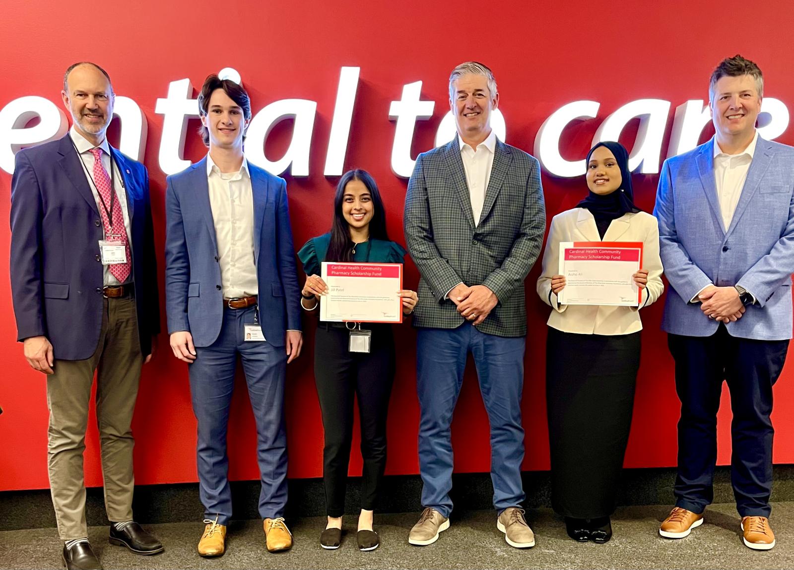 Jill Patel and Aisho Ali with members of the Cardinal Health team.