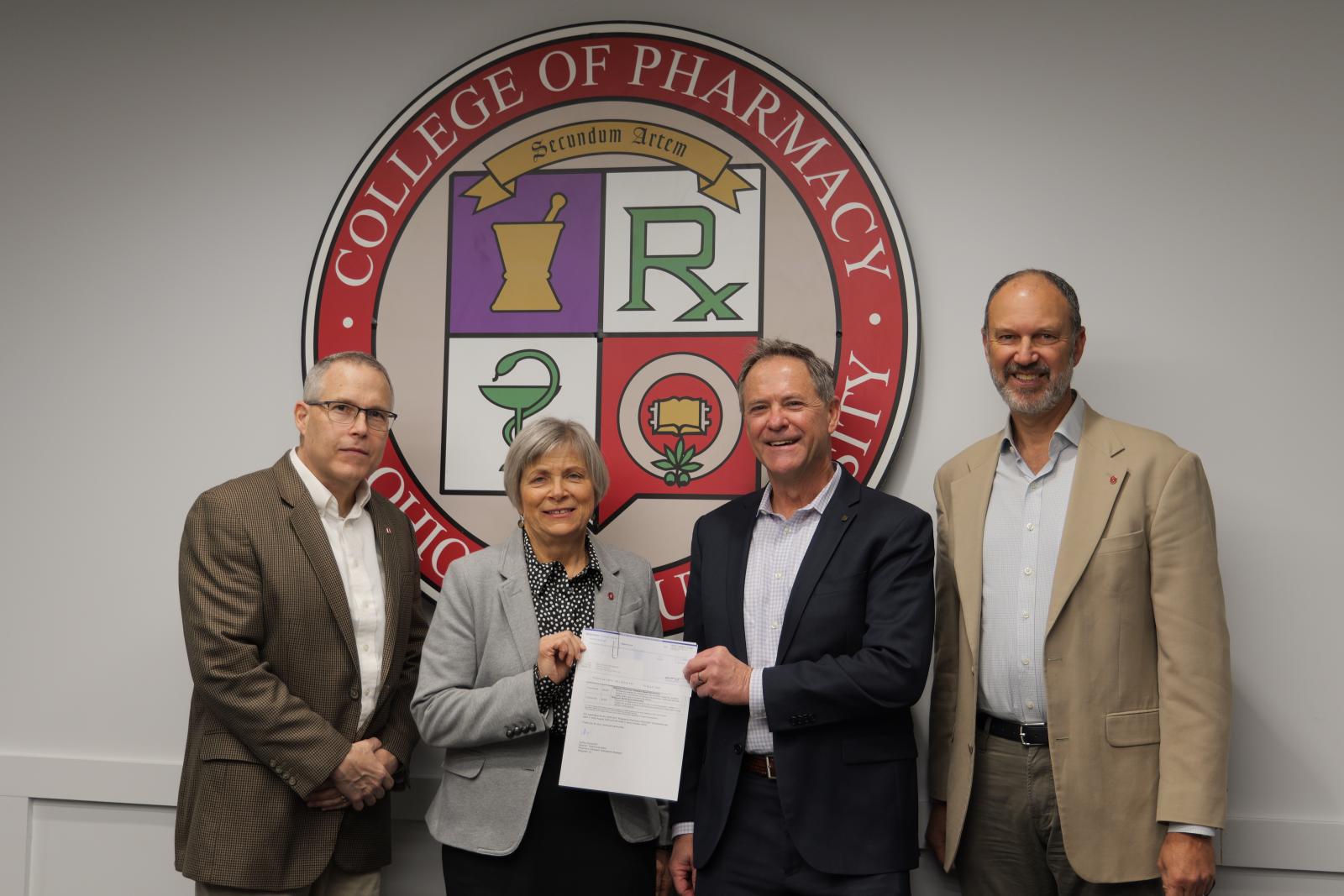 Dr. McAuley, Dean Kroetz, Rusty Maney and John Swartz