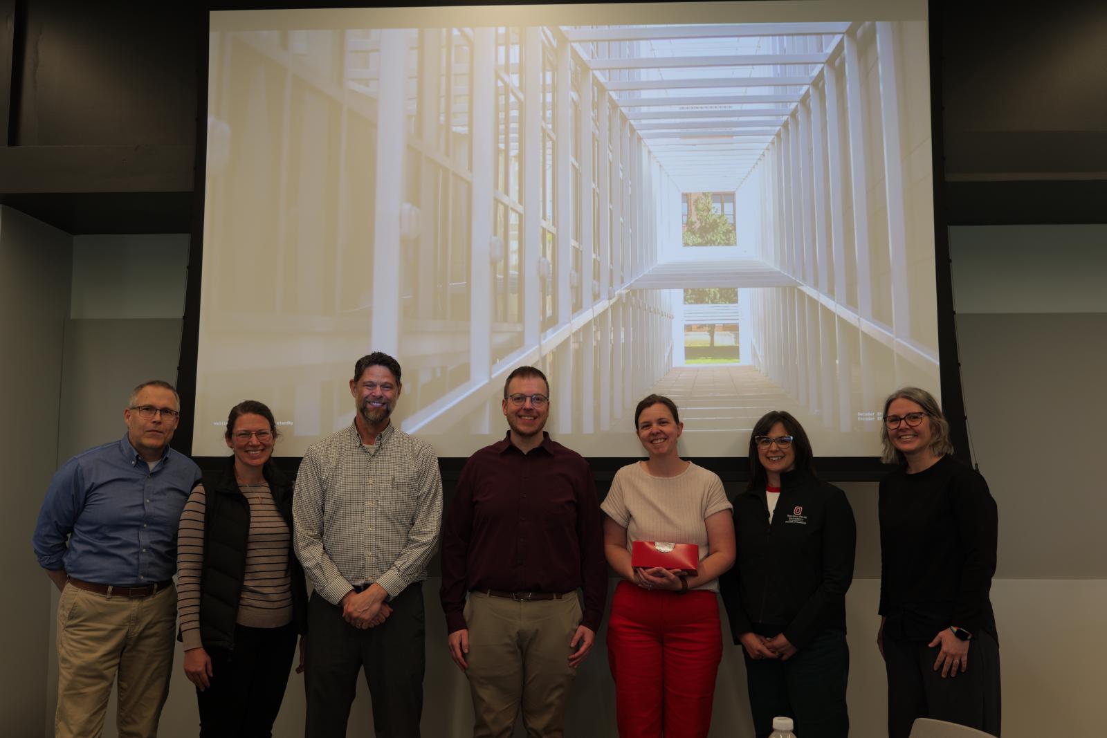 Dr. Cline and faculty standing for a photo