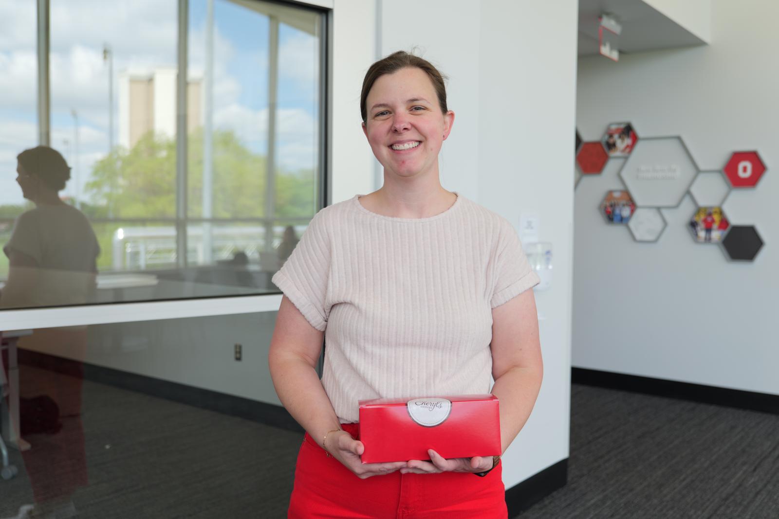 Dr. Cline standing with her cookies