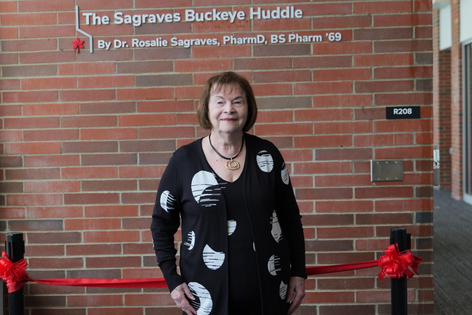 Dr. Sagraves in front of her sign