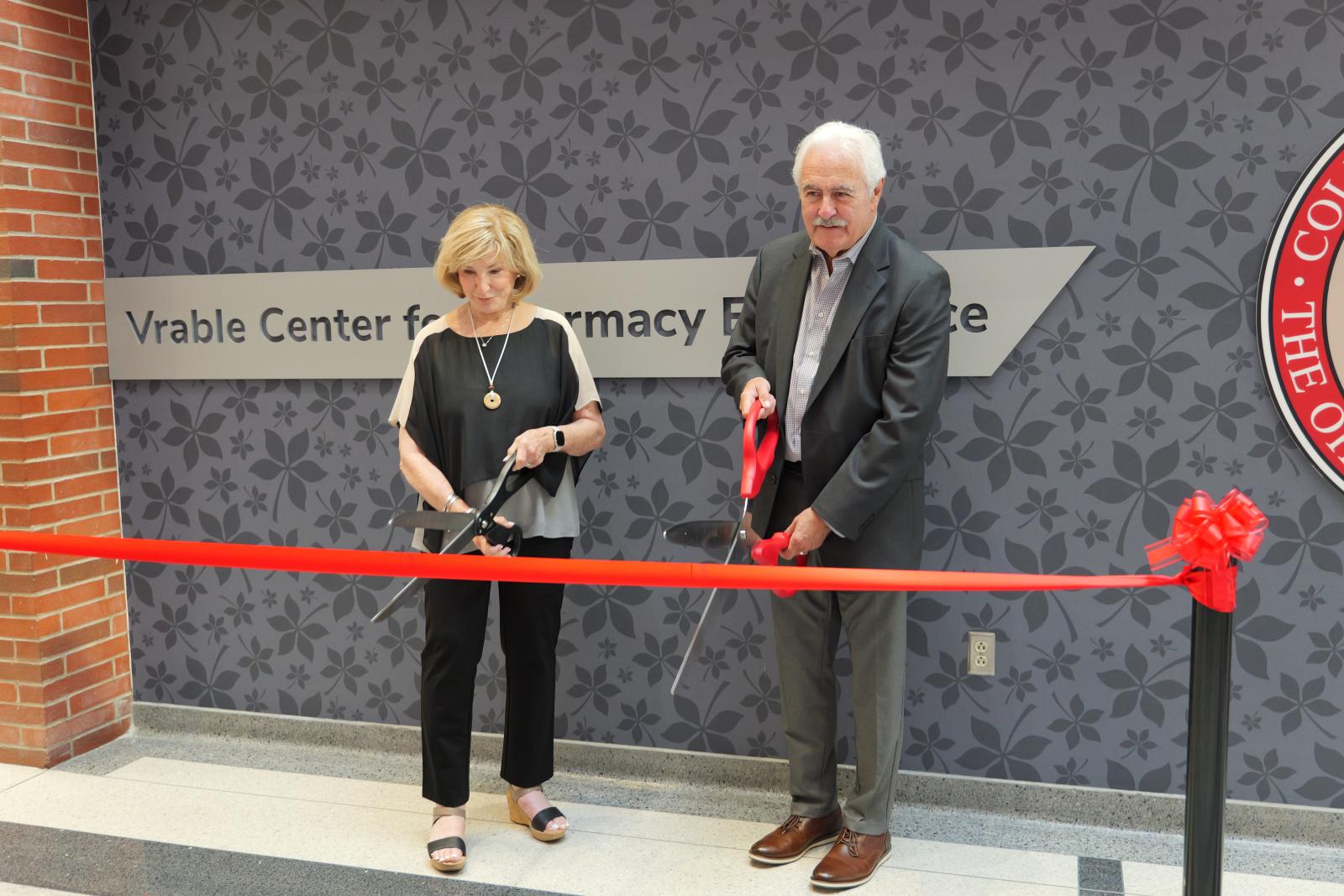 Al and Linda Vrable cutting the ribbon