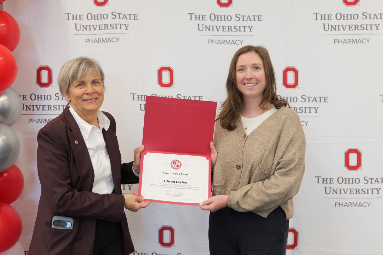 Dean Kroetz and Allison Layton with award